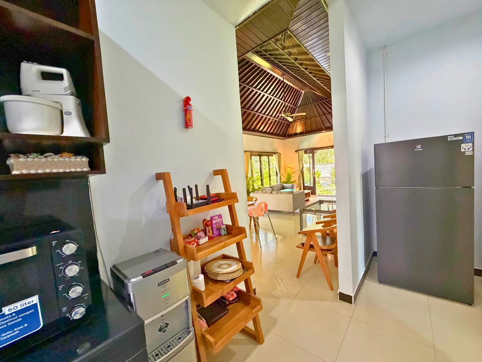 Kitchen, refrigerator and living area at Family Villa Sanur