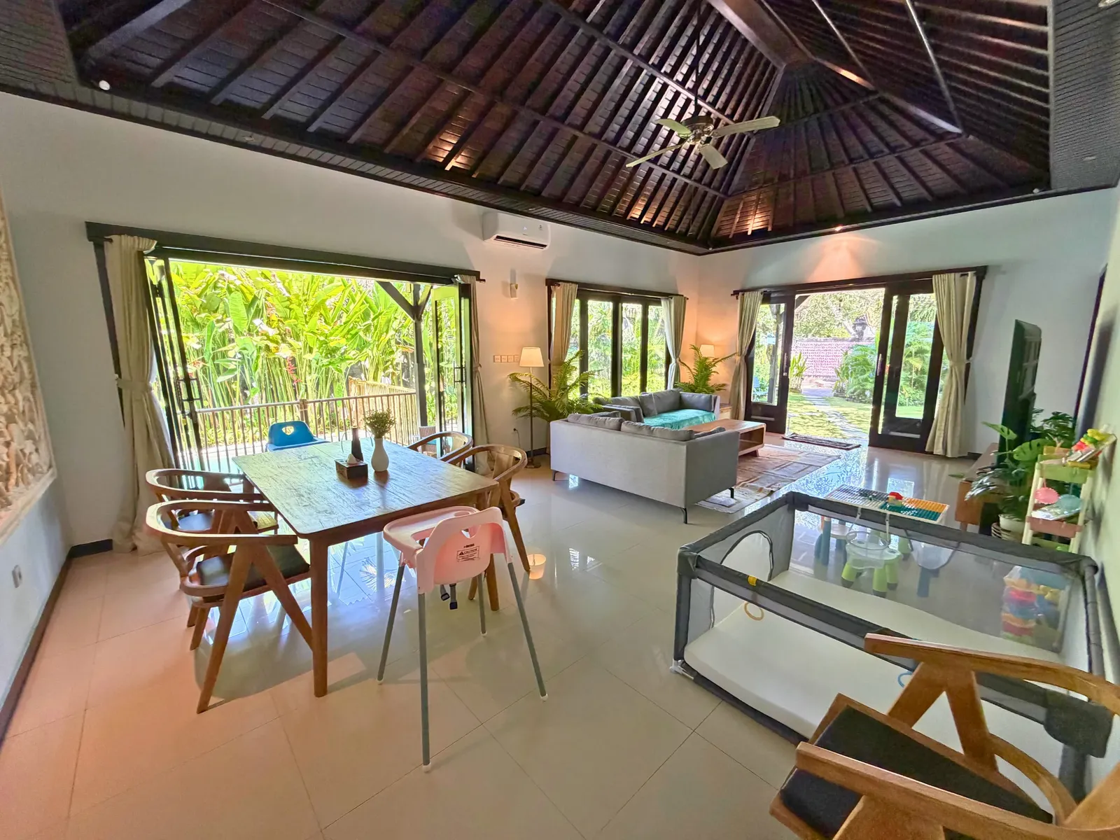 Living and dining area beside the kitchen at Family Villa Sanur
